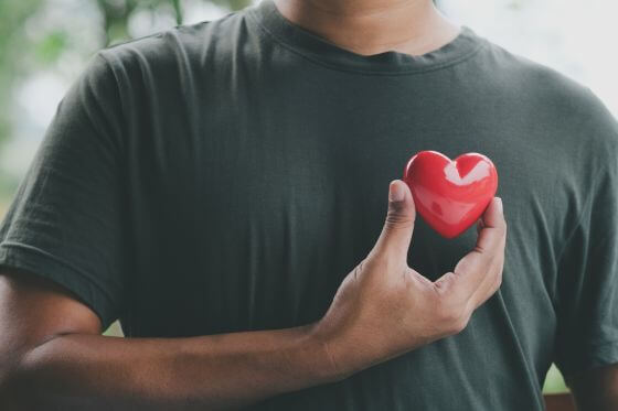 Man holding a heart